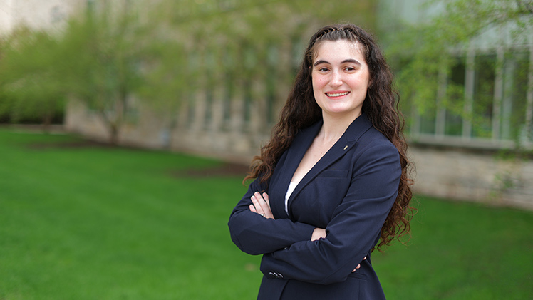 Outdoors portrait of honors student Gabriella DeVage, who received her degree in legal and paralegal studies.