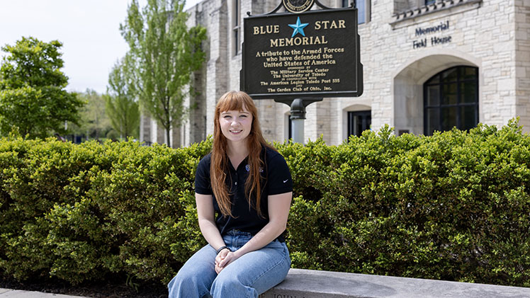 Outside portrait of Ingrid Harmon, who graduated with a bachelor's degree in exercise science, and now will report to Fort Sam Houston to begin her journey as a U.S. Army physical therapist.