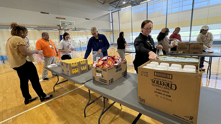 UTMC medical staff volunteered to fill meal bags during a Tuesday community service event in the Morse Fitness Center on Health Science Campus.