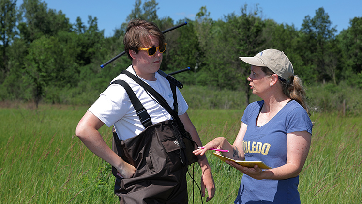 Caleb Lawrence, an environmental sciences senior, discusses his field research into the nesting habits of spotted turtles with Dr. Jeanine Refsnider, a professor of ecology and principal investigator of the project supported by the U.S. Fish and Wildlife Service.