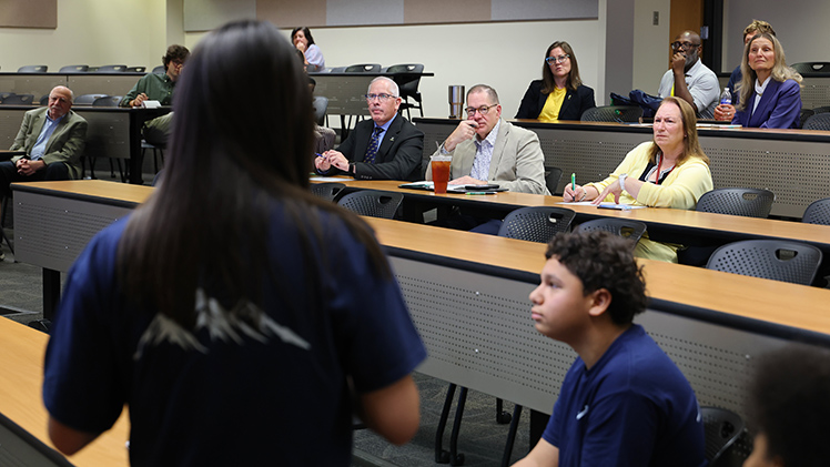 The “Shark Tank”-style panel featured, from left, UToledo President James Holloway, Provost Mitchell S. McKinney and Dr. Susan Shultz, a senior lecturer in the Department of Marketing and International Business. The presentation event was the culmination of the three-day, on-campus RISE Into Business summer enrichment camp, which provided high school students hands-on opportunities to explore marketing, finance, accounting and other core business skills.