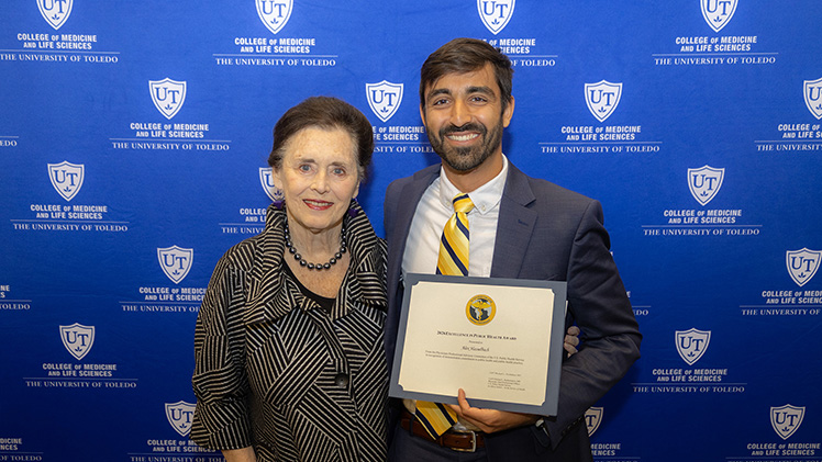 Dr. Donna Woodson stands with Alex Hasselbach at the 2026 College of Medicine and Life Sciences Graduation Awards.