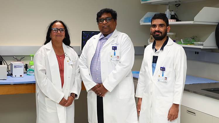 From left, Drs. Sailaja M. Paruchuri, Charles Thodeti and Lakshminarayan Reddy Teegala from the Department of Physiology and Pharmacology pose for a photo.