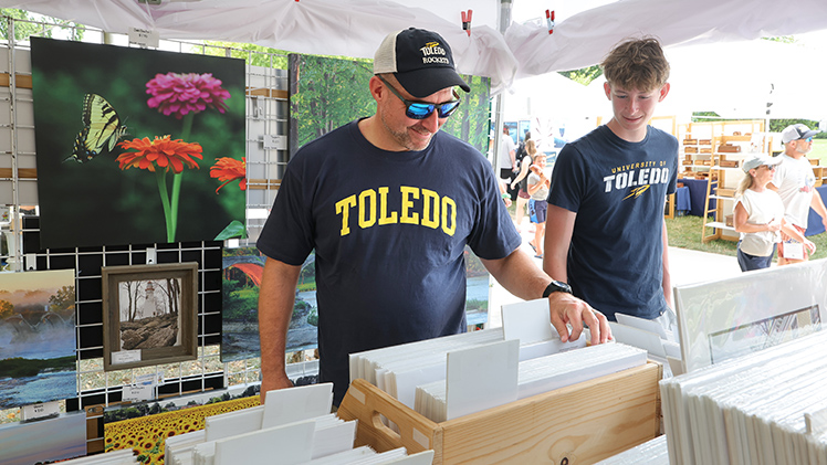 Eric Slough, a former employee with the Alumni Association, and his 16-year-old son, Benjamin.