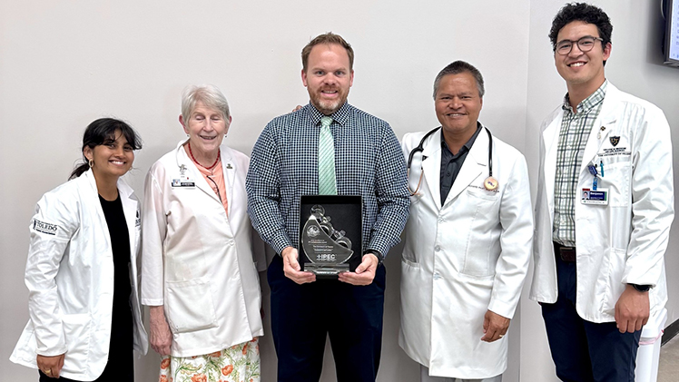 From left, Desha Perera, CommunityCares Clinics director of administration and a student in the College of Medicine and Life Sciences; Dr. Susan Batten, an associate professor in the School of Nursing; Dr. Mitch Howard director of the IPPE program and the PGY1 Community-Based residency program in the College of Pharmacy and Pharmaceutical Sciences; Dr. Richard Paat, a clinical professor of internal medicine in the College of Medicine and Life Sciences; and Bejamin Theis - CommunityCares Clinics executive director and a student in the College of Medicine and Life Sciences.