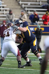 In-game photo of Zac Kerin, a three-time All-MAC center for the Rockets who started 38 consecutive games from 2011-13.