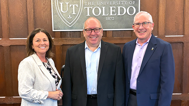 From left to right, Dr. Grace Bochenek, UToledo vice president for research, Dr. David J. Gorsich, chief scientist for the U.S. Army's DEVCOM Ground Vehicle Systems Center (GVSC) and UToledo President James Holloway.