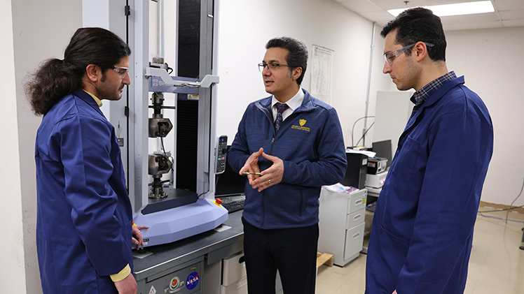 Pictured, from left to right in UToledo's Failure, Fracture and Fatigue Laboratory, are Mohammad Mahtabi, a Ph.D. student in mechanical engineering, Dr. Meysam Haghshenas, associate professor in the Department of Mechanical, Industrial, and Manufacturing Engineering (MIME), and Mojtaba Roshan, a Ph.D. student in mechanical engineering.