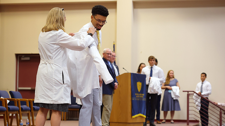 Medical Student Andrew Beard receives his white coat