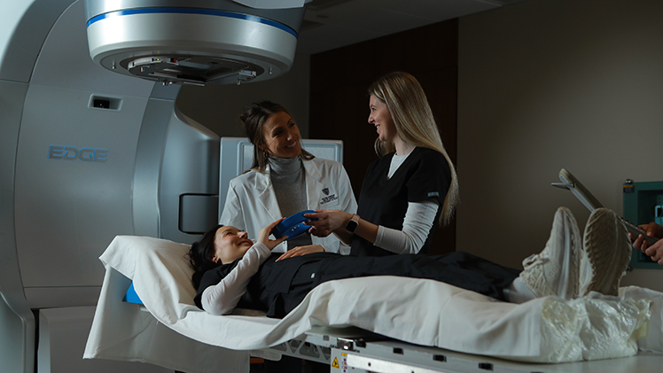 Kelsey Hoffman, director of the Radiation Therapy Program, with students.