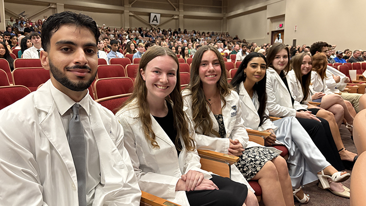 Incoming Pharm D students Bilal Abdelhamid, Katherine Eaton, Cameron Schmitt, Jeanine El Khechen, Elizabeth Hannah and Adisyn Kish after receiving their white coats.