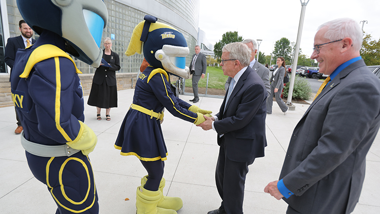 Rocky and Rocksy greet Ohio Gov.Mike DeWine with UToledo President James Holloway to the right.