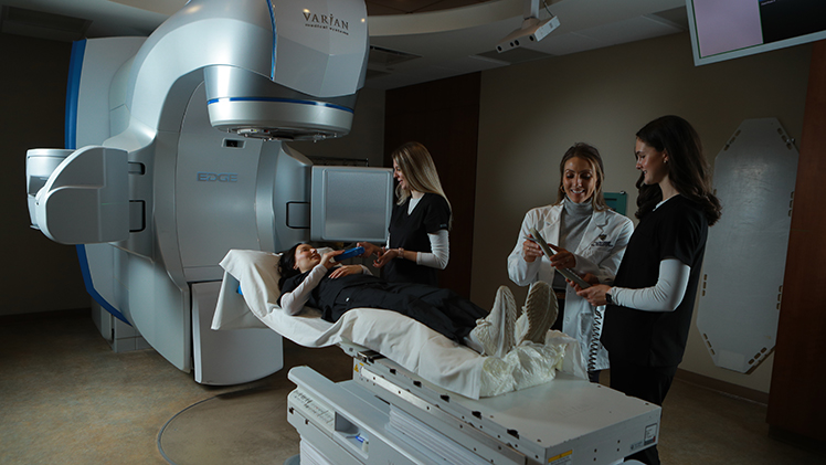 Radiation Therapy Program Director Kelsey Hoffman with students