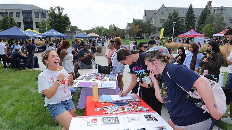From left, Karina Delgado, a junior in biology and member of the Ohio Student Association, shares a laugh with Isabelle Lambert, a sophomore in nursing, and McKenzey Weis, a junior in nursing, at 2026 fall Campus Involvement Fair.