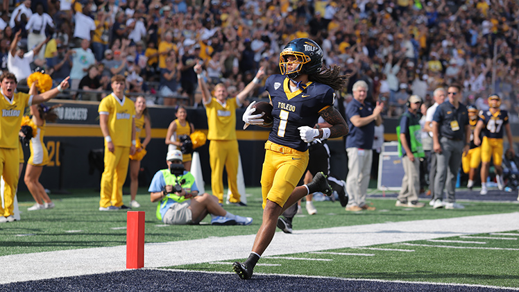 Rocket player runs into the end zone for a touchdown.