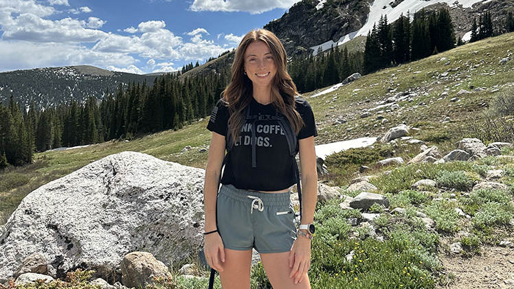 Portrait of UToledo graduate student standing outside in the wilds of Colorado.