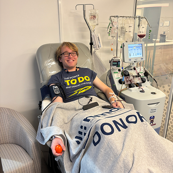 Photo of UToledo student Luke Boyd in a hospital bed following his lifesaving blood stem cell and bone marrow donation.