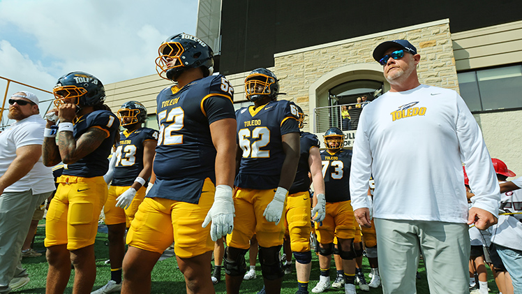 Toledo Football Head Coach Mike Jacobs about to lead his team onto the field for his first home game.