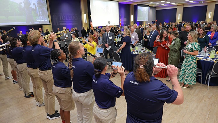 Photo of Rocket band performing at Homecoming Gala to attendees.