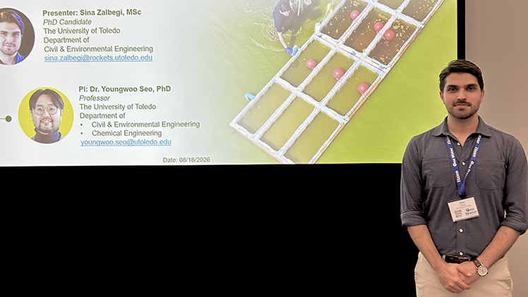 Photo of Sina Zalbegi in front of his winning presentation at the Ohio Section of the American Water Works Association’s Fresh Ideas competition.
